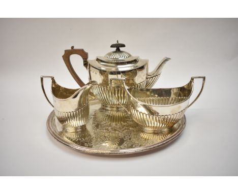 An Elkington &amp; Co Ltd silver three piece tea set with treen knop and handle, melon-fluted base, Birmingham 1897, 1108g, w