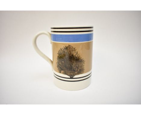 A 19th Century Mocha Ware mug of large proportions in blues and browns, mushroom ground with black feathered trees, blue and 