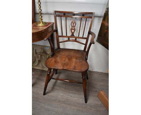 An elm and mahogany stick back Mendlesham chair on an "H" stretcher