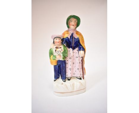 A circa 1850's Staffordshire figural group portraying David Copperfield and Clara Peggotty, characters from Charles Dickens n