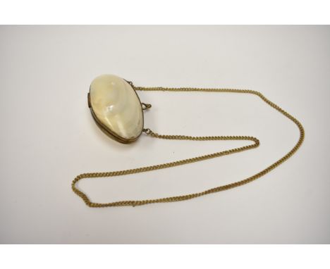 A mother-of-pearl clamshell purse, 9cm long shell