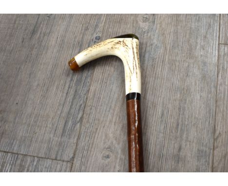 A hazelwood deer antler handle walking stick with ebony collar, 85.5cm long