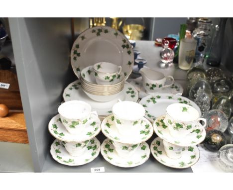 A Royal Albert 'Colclough' fine bone china tea service having semi scalloped rim and gold rim, decorated with ivy leaf on a w