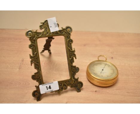 An early 20th century Negretti &amp; Zambra altimeter, H7cm, sold together with a brass frame, (2)