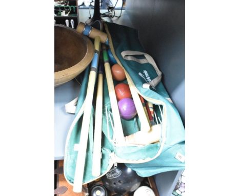 A ApudArmis Croquet set with original green canvas bad, comprising of 6 mallets, 6 coloured balls, 8 hoops and 2 stakes