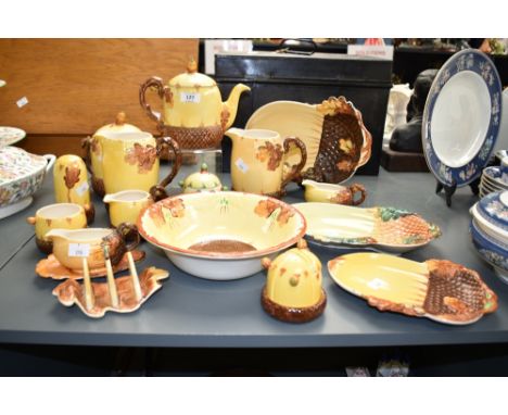 A Burleigh ware ceramic dinner service, having pine and leaf decoration, makers mark to base, pattern '6180' to include tea p