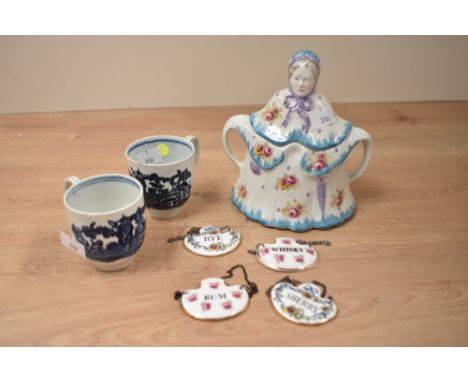 A early 20th century ceramic tea pot in the form of a little old lady, h15.5cm, sold together with a pair of cups and 4 Royal