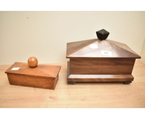 A 20th century mahogany tea caddy, of sarcophagus form with unusual sliding cover and screw locking mechanism 20cm x 26cm and