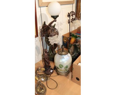A group of decorative patinated resin figural table lamps; a glass ovoid table lamp; and a pair of wall sconces