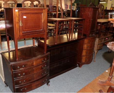 Reproduction bow front chest of drawers; two caned seat chairs; bookcase; bedside table; bow front chest; and a pot cupboard 