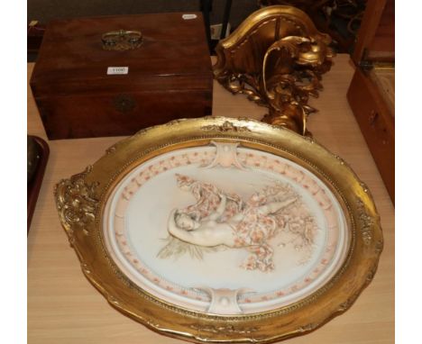A carved giltwood wall bracket in the Florentine style; a ceramic wall plaque of a semi-clad female figure; ad a mahogany tab