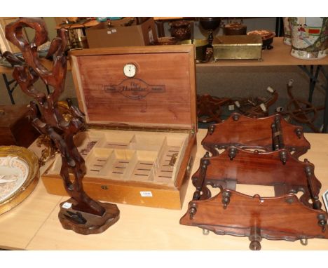 A Victorian hanging wall shelf; a humidor; and a carving of birds perched in a tree