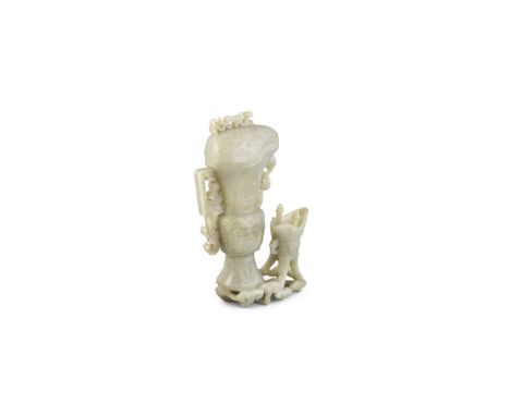 A LARGE CARVED JADE GROUP, 18/19th century, modelled in the form of a wine guang and jue, following the bronze prototype, the