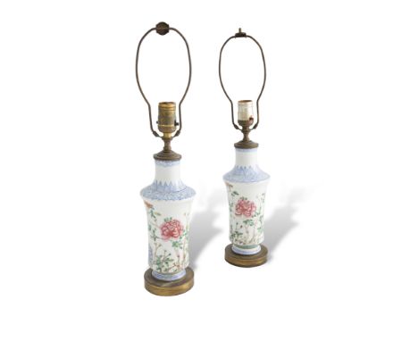 A PAIR OF FAMILLE ROSE PORCELAIN TABLE LAMPS, late 19th/ early 20th century, each of baluster form, the waisted neck with ban