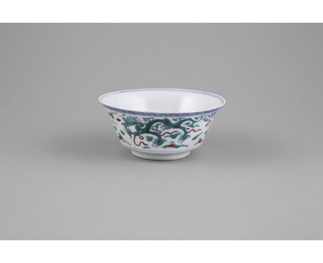 A DOUCAI ENAMEL FLARED DRAGON BOWL, 19th century in the Kangxi style, the interior centred with front facing dragon, in green