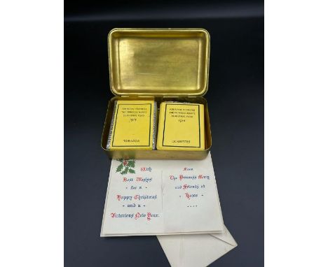 A 1914 Queen Mary WWI Christmas tin, with original Christmas card message, tobacco  and cigarettes.