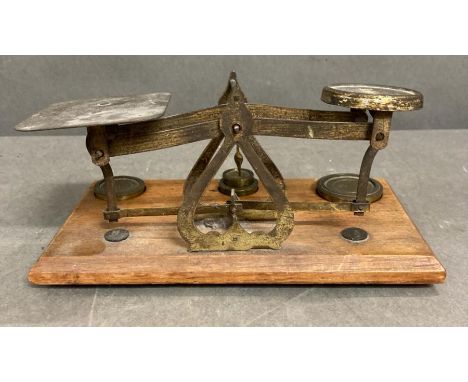 A set of oak and brass postal scales 