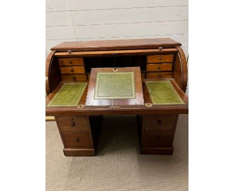 An English mahogany and leather cylinder roll top desk by Moore London, Tambour front with sliding/pull out writing panel, ad