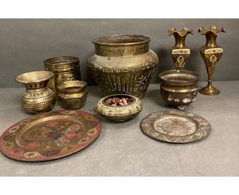 A selection of brass items to include a planter and various pots, bowls and plates 