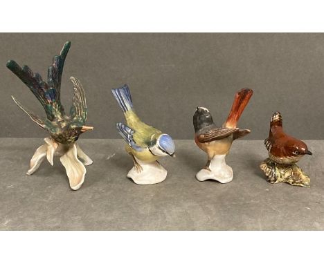 A selection of three W Goebel china birds and one by Beswick.