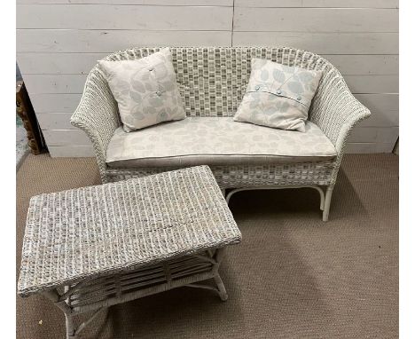 A wicker two seater sofa and coffee table (H77cm W137cm D65cm)