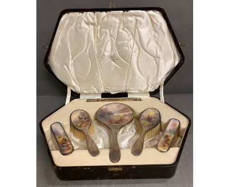 A cased silver mounted dressing table set with highland scene back panels signed Stinton for Royal Worcester. 1928 silver mou