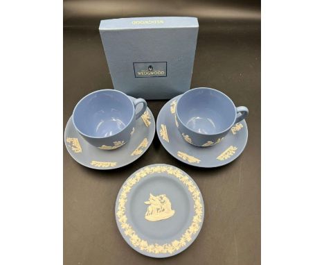 A Wedgewood tea cups and saucers along with a trinket dish 