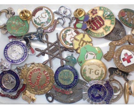 Box of enamel badges 