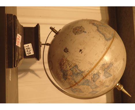 Modern revolving globe showing voyages of discovery throughout history H: 48 cm to top of finial