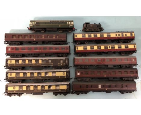 A TT scale steam locomotive along with a OO gauge Hornby BR green diesel locomotive and assorted OO gauge coaches