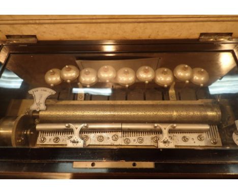 Antique F Conchon music box playing 12 different tunes on intact comb with nine bells. Tulip wood inlay to mahogany box CONDI