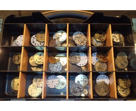 Box of pocket watch movements and faces