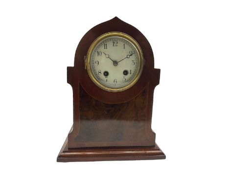 An Edwardian c1910 mahogany veneered mantle clock in a pointed arch case with inlaid satinwood stringing, white enamel dial w