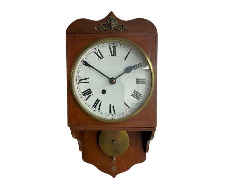 An early 20th century wall clock in a mahogany case, ogee shaped pediment, movement bracket and conforming apron, fusee timep