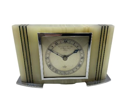 A 1950's rectangular white Onyx cased mantle clock retailed by Gerrard &amp; Son, London, with a sheet metal dial and square 