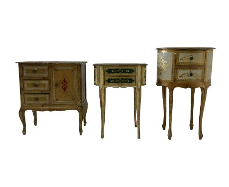 Cream and gilt lamp or bedside table, oval form and fitted with two drawers, decorated with scrolling foliate patterns (W53cm