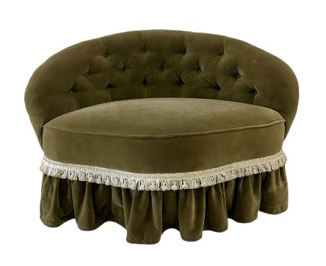 Victorian tub chair, upholstered in green buttoned back fabric, raised on turned supports, terminating in ceramic castors 