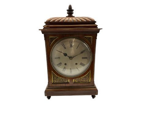 Winterhalder and Hoffmeier striking mantle clock in a mahogany case with a carved gadrooned top surmounted by a turned wooden