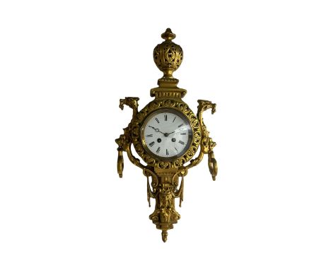 An imposing and decorative late 19th century French wall clock c1890, substantial cast brass case surmounted by a pierced urn