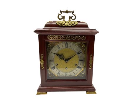 A 20th century replica 17th century bracket clock with an inverted bell top and applied brass castings and side frets, with a