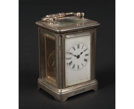 A Victorian silver cased miniature carriage clock by John Millward Banks. With enamel dial and and having platform escapement