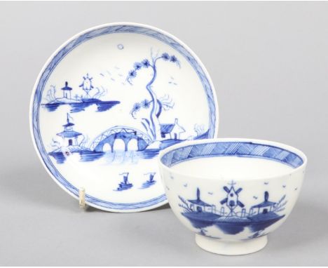 a Caughley teabowl and saucer. Painted in underglaze blue with the Bridge and Windmill pattern c.1780, saucer 12.25cm diamete