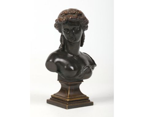 A 19th century French bronze and spelter bust on stepped square socle plinth. Formed as a Grecian Classical maiden. Stamped L