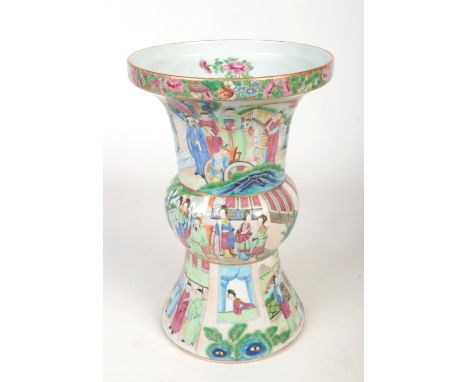 A large mid 19th century Cantonese gu shaped vase. Painted in coloured enamels with through continuing bands of figures, 38cm