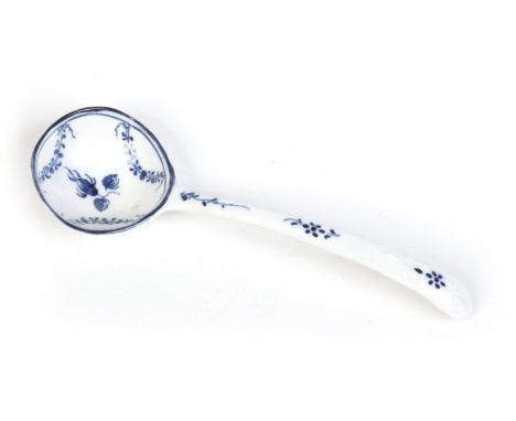 A rare Caughley small ladle. With delicate scroll and shell mouldings, painted in underglaze blue with a rose hip and leafy s