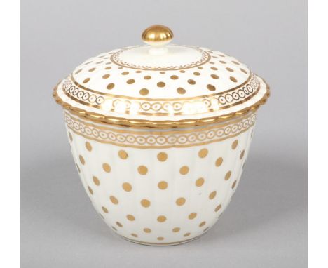 A Caughley fluted sucrier and cover. Decorated in gilt with the Polka Dot pattern c.1780, 11cm high.  Chip to the underside r