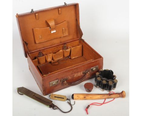 A vintage tan leather fitted vanity case monogramed M. F. along with a quantity of sport / hunting themed items. A peg drawer