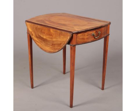 A George III satinwood Pembroke games table. Crossbanded in mahogany, with strung inlay and raised on square tapering support
