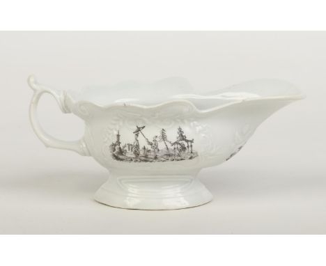 A Worcester high footed silver shaped sauceboat with moulded cartouches and scrolling handle. Printed in smokey primitive sty