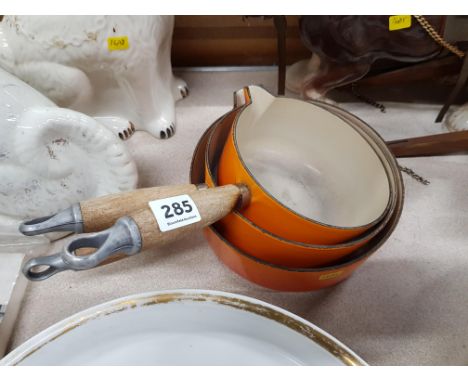 SET OF ORANGE CAST ENAMEL LE CREUSET SAUCEPANS